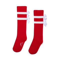 ADEE Complete the look with the red Astrid knee high sock. Finished with a contrast white stripes and satin bows.
