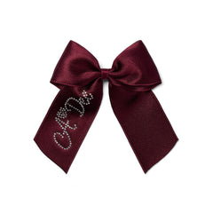 ADEE Chevron Charm Collection. Add the perfect finishing touch with the Ariah Bow complete with the signature A*Dee diamante logo. Deep Cherry