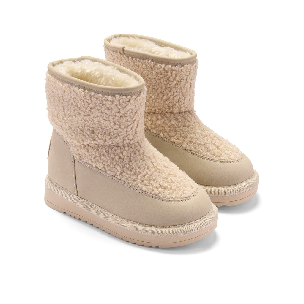 ADEE A cosy update to everyday footwear, the Teddie boots are crafted from soft faux suede and finished with a chunky sole and signature logo detail. Stone Beige