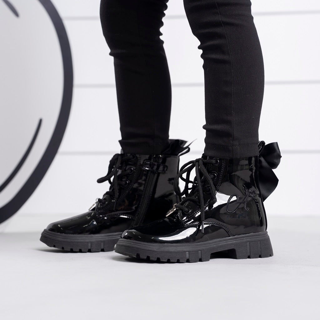 ADEE Go back to school in style with the black Selene boot. Featuring branding embroidered branding and lace up fastening. Finished with non-slip rubber soles.