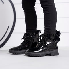 ADEE Go back to school in style with the black Selene boot. Featuring branding embroidered branding and lace up fastening. Finished with non-slip rubber soles.