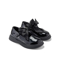 ADEE The Lyra shoe is perfect for school, with pretty bows on the velcro strap and embroidered logo to the side. Finished with non-slip rubber soles. Black