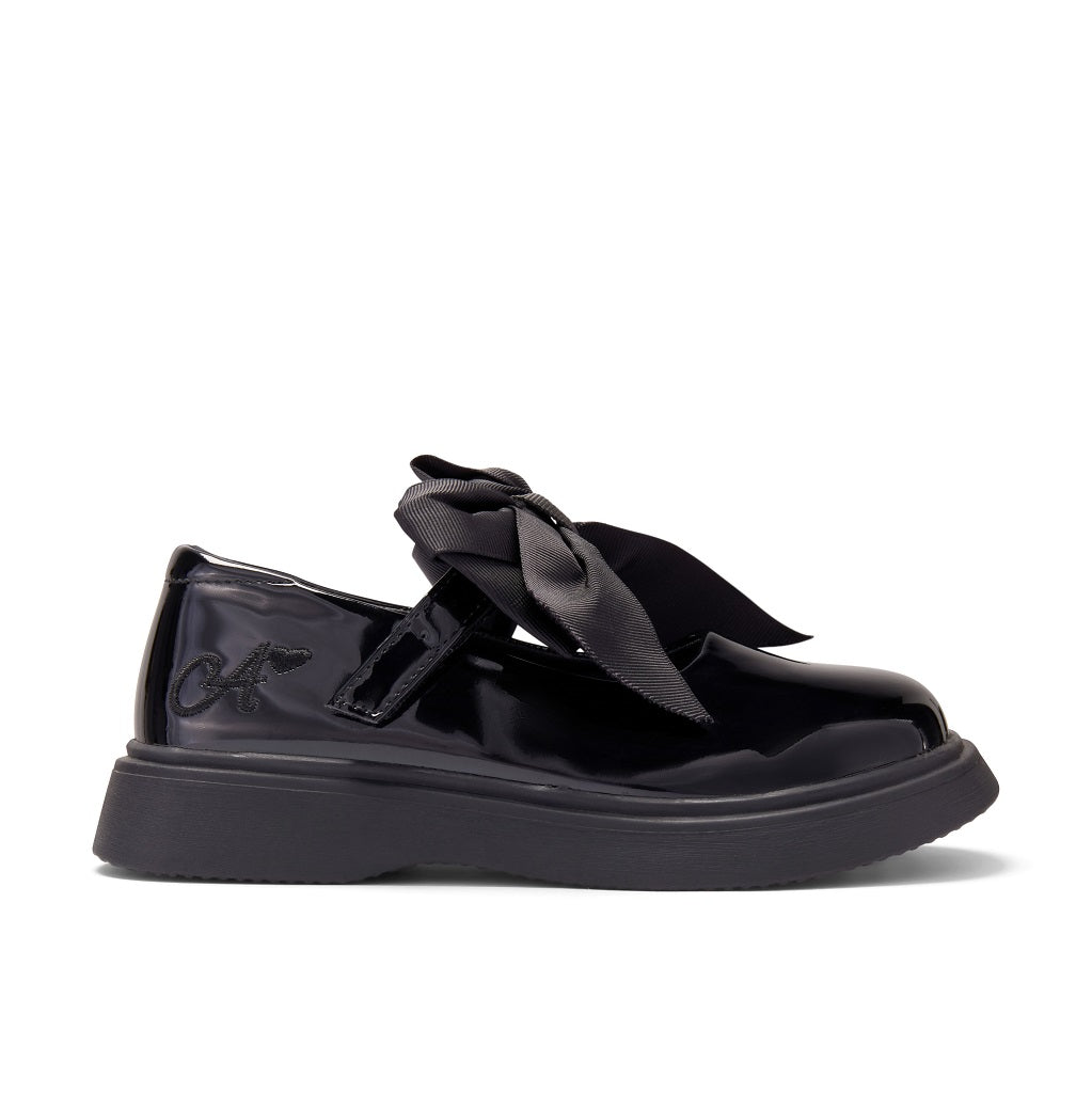 ADEE The Lyra shoe is perfect for school, with pretty bows on the velcro strap and embroidered logo to the side. Finished with non-slip rubber soles. Black