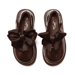 ADEE The Lyra shoe is perfect for school, with pretty bows on the velcro strap and embroidered logo to the side. Finished with non-slip rubber soles. Brown.