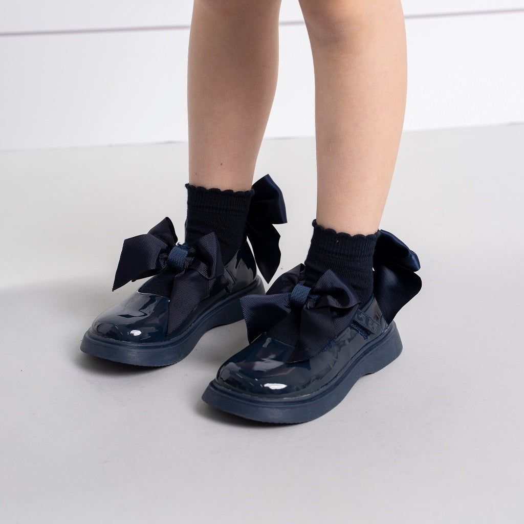 ADEE pixie ankle socks come in 3 classic colourways with a satin frill detail around the cuff, adding a touch of style to any outfit. Dark Navy