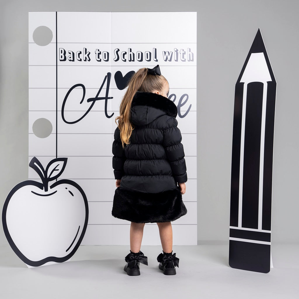 ADEE BTS The Rhea long length padded jacket features a luxurious fur trim around the hem and on the hood. Complete with a diamante badge on one sleeve and branded zip fastening. The perfect jacket to keep cosy going back to school.