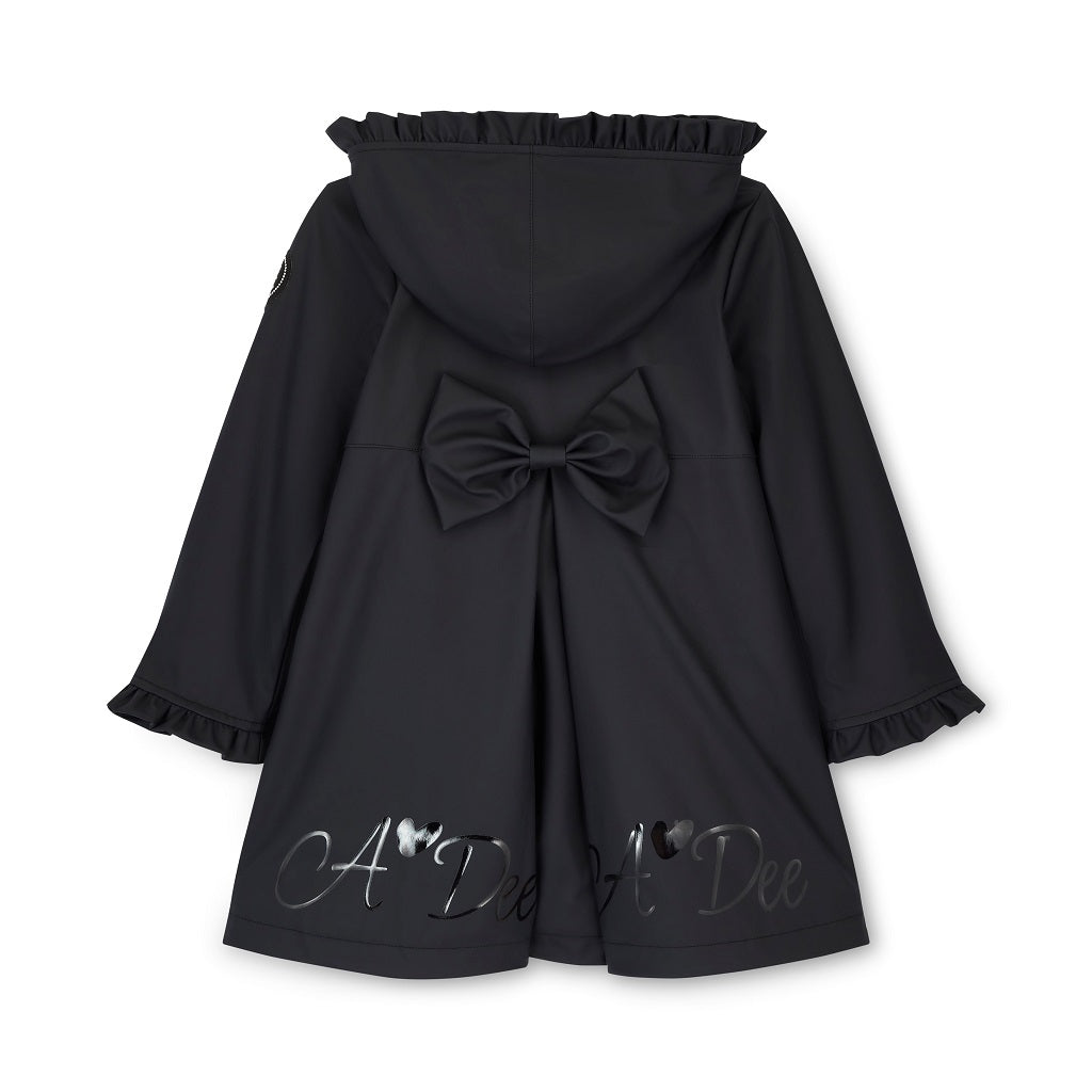 ADEE BTS The Nova is the must-have back to school raincoat! It features front and back pleats with pretty bow detailing, branding around the hem and frills at the cuffs and hood. Complete with a silver reflective logo badge on one arm and a silver branded puller. Black