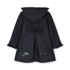 ADEE BTS The Nova is the must-have back to school raincoat! It features front and back pleats with pretty bow detailing, branding around the hem and frills at the cuffs and hood. Complete with a silver reflective logo badge on one arm and a silver branded puller. Black