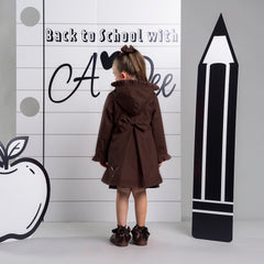 ADEE BTS The Nova is the must-have back to school raincoat! It features front and back pleats with pretty bow detailing, branding around the hem and frills at the cuffs and hood. Complete with a silver reflective logo badge on one arm and a silver branded puller. Brown