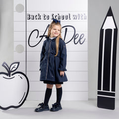 ADEE BTS The Nova is the must-have back to school raincoat! It features front and back pleats with pretty bow detailing, branding around the hem and frills at the cuffs and hood. Complete with a silver reflective logo badge on one arm and a silver branded puller. Dark Navy