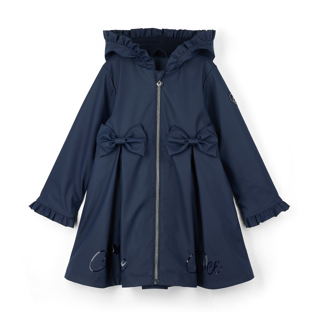 ADEE BTS The Nova is the must-have back to school raincoat! It features front and back pleats with pretty bow detailing, branding around the hem and frills at the cuffs and hood. Complete with a silver reflective logo badge on one arm and a silver branded puller. Dark Navy