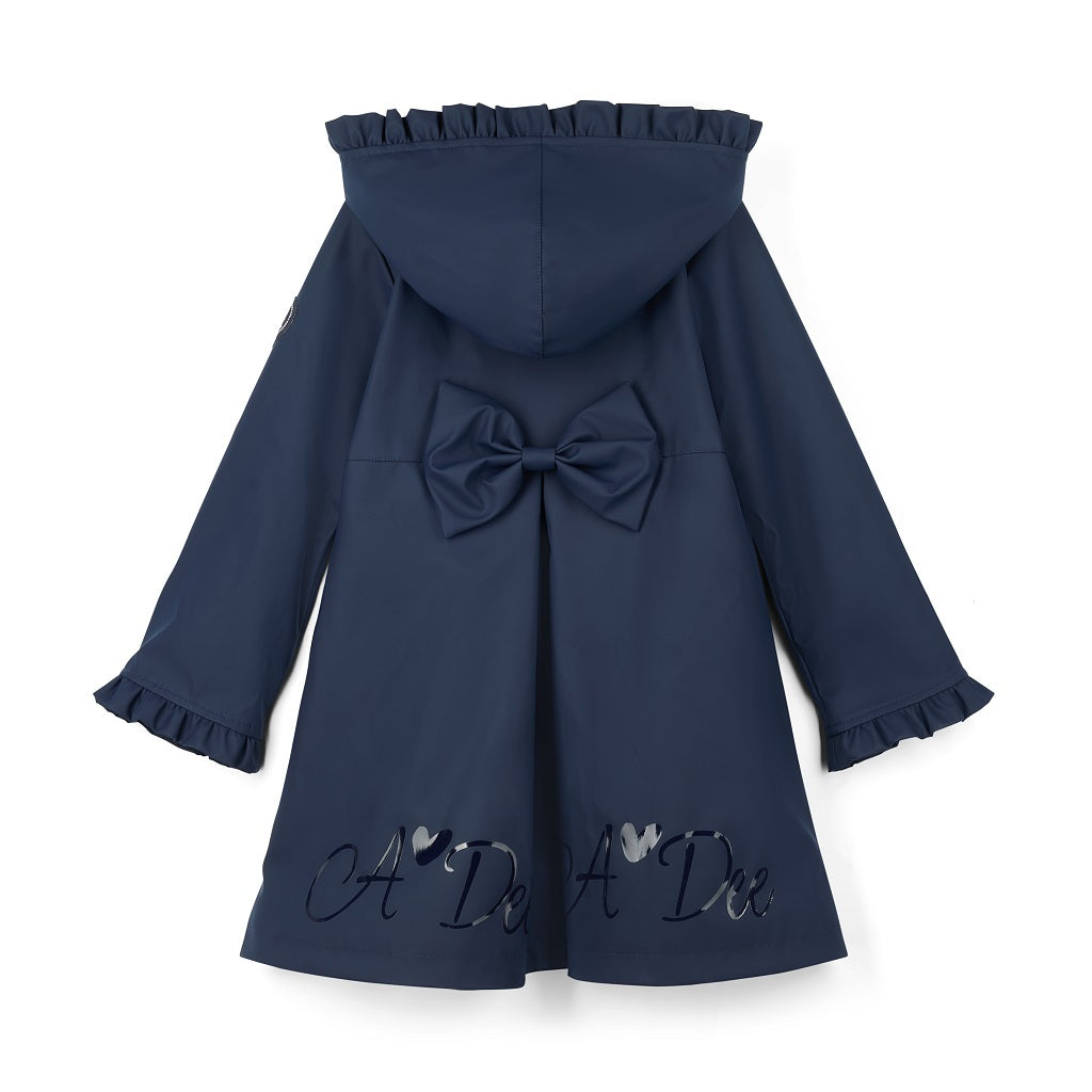 ADEE BTS The Nova is the must-have back to school raincoat! It features front and back pleats with pretty bow detailing, branding around the hem and frills at the cuffs and hood. Complete with a silver reflective logo badge on one arm and a silver branded puller. Dark Navy