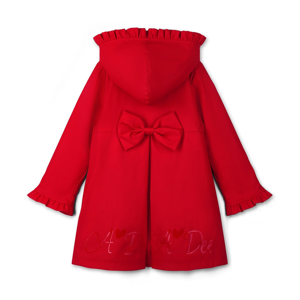 ADEE The Nova is the must-have back to school raincoat! It features front and back pleats with pretty bow detailing, branding around the hem and frills at the cuffs and hood. Complete with a silver reflective logo badge on one arm and a silver branded puller. Red