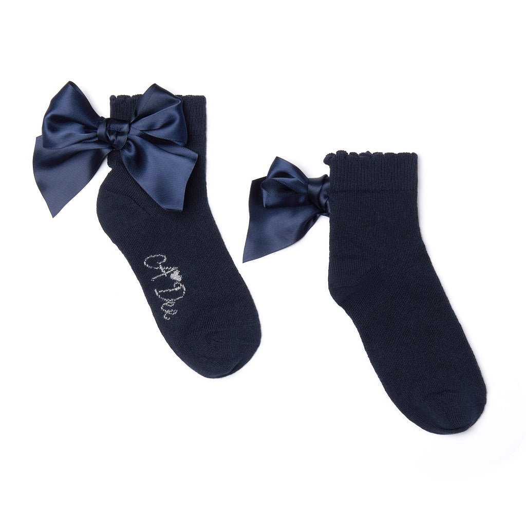 ADEE pixie ankle socks come in 3 classic colourways with a satin frill detail around the cuff, adding a touch of style to any outfit. Dark Navy