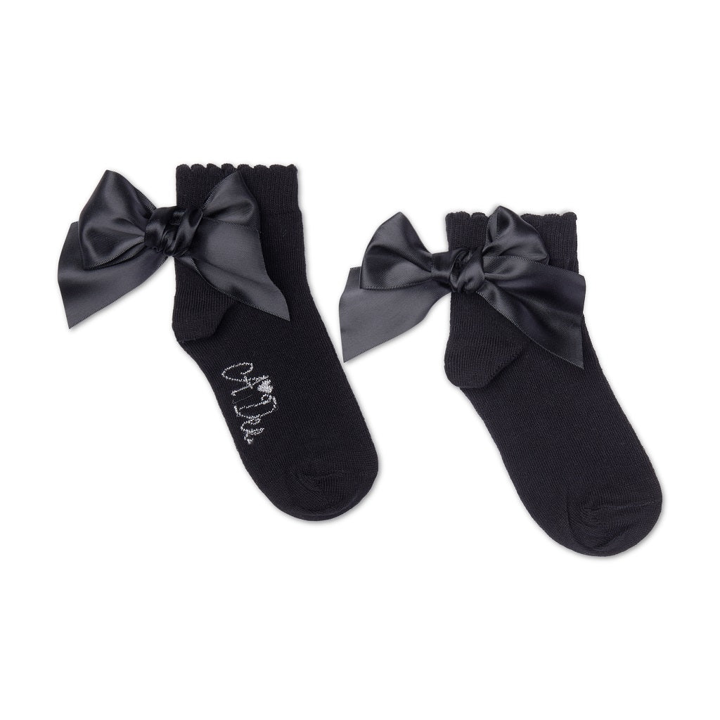 ADEE pixie ankle socks with a satin frill detail around the cuff, adding a touch of style to any outfit. Black