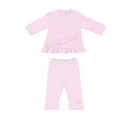 Pastels & Co baby girl's two-piece outfit set in light pink, featuring a long-sleeve top with a ruffle detail across the front and matching flare bottoms.
