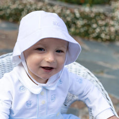 EMILE et ROSE Gibson Keep baby cool with this very practical sun hat with a neat brim and an adjustable chin strap, secured with soft velcro