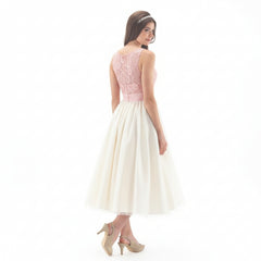 LINZI JAY Girls tea length dress with lace bodice and tulle overlay skirt. Satin pleated waistband. Zip fastening up back.